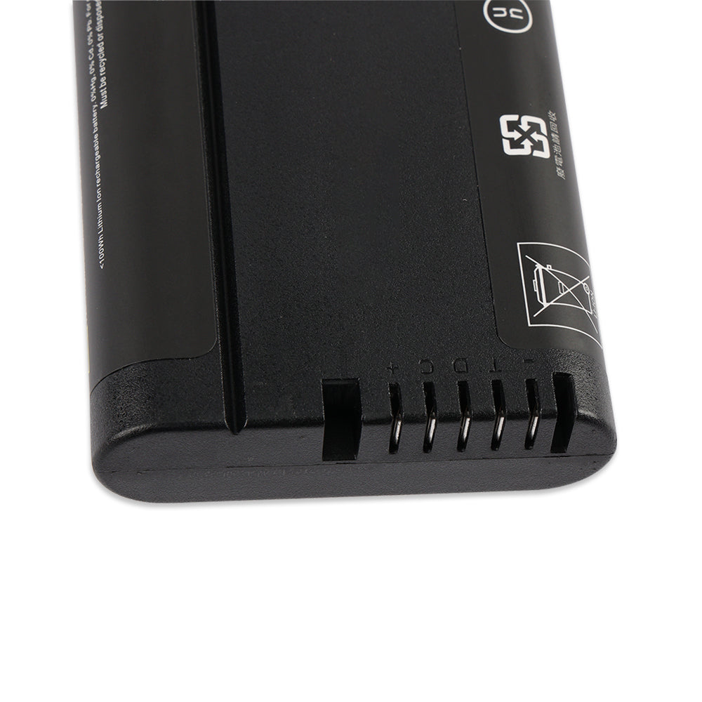 Close-up of the KingSener NL2054 battery interface connector showing five metal contact pins and safety icons.